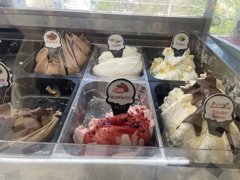Gelato tubs in the counter: chocolate, vanilla, lemon, strawberry and Kinder Bueno